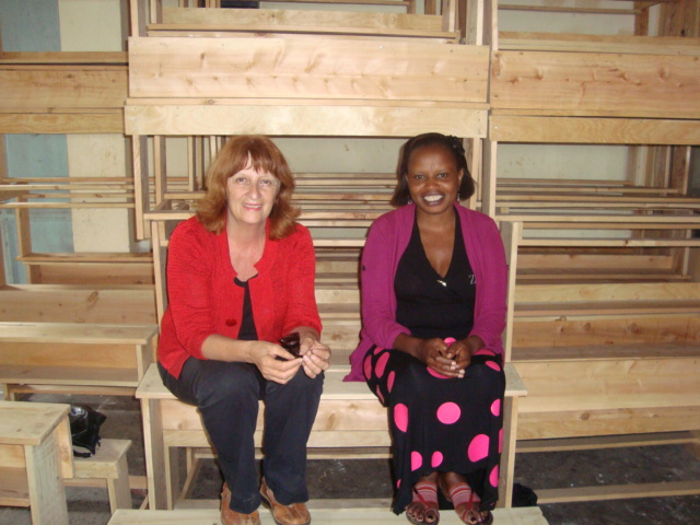 Annie with Irene, donating desks for a classroom at Manjani Mingi IDP Camp.